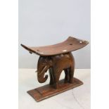 Ashanti Style Hardwood Stool with Curved Seat set on an Elephant Shaped Base, 62cms wide x 51cms