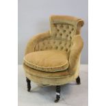 Victorian Upholstered Tub Chair with Button Back and Padded Seat raised on turned legs with brass