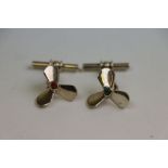 Pair of silver port and starboard propeller cufflinks set with a conical cabochon cut carnelian