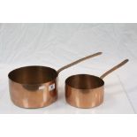 Two large vintage Copper saucepans with riveted handles, both of which have stamped numbering.