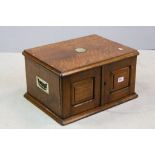 Late Victorian Table Top Oak Cabinet, the two doors opening to reveal two shelves, Brass Shield