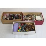 Three boxes of costume jewellery to include necklaces, bracelets, bangles etc
