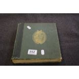 Green stamp album with a quantity of world stamps mint and used