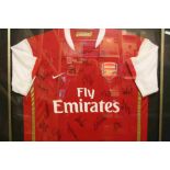 Football autographs - Arsenal FC, a framed and glazed home shirt from the opening of the Emirates