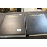 Two black Royal Mail binders containing a quantity of Post Office generic smilers sheets in