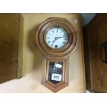 Small Oak Cased Hanging Wall Clock with White Enamel Face and Key, 30cms high