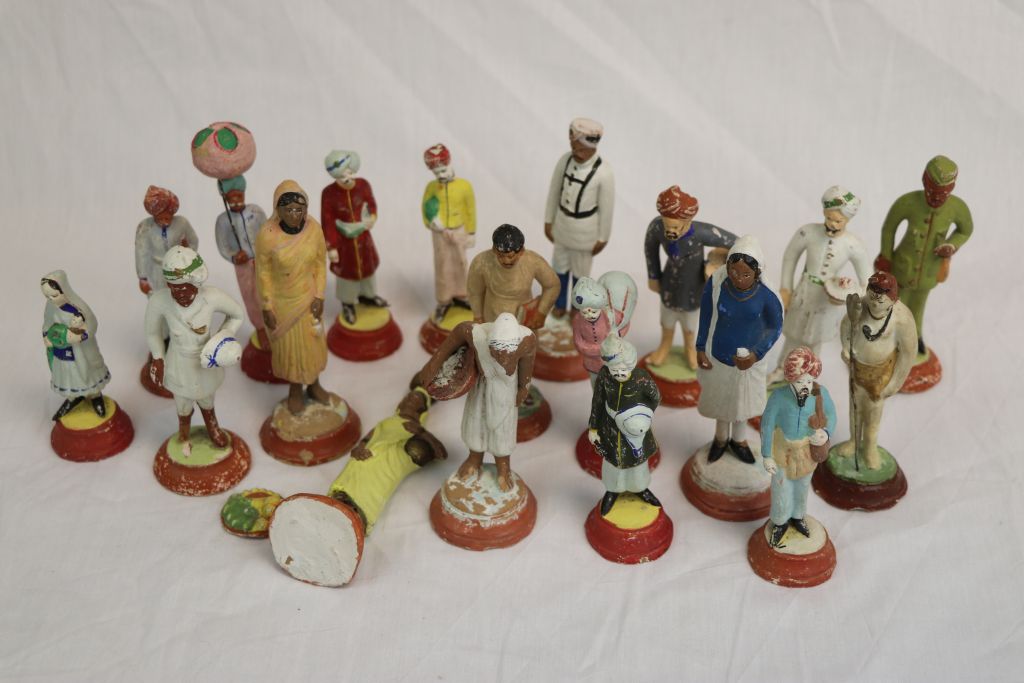 Collection of vintage Painted Indian Plaster figures, all different to include Military style