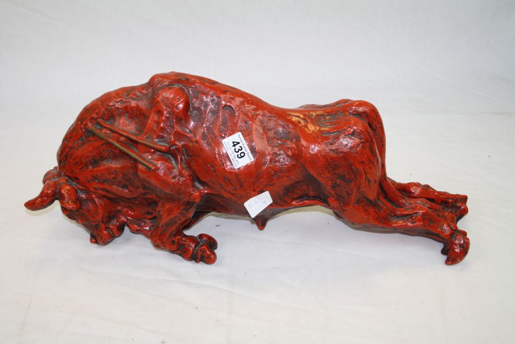 Red Sculpture of a Raging Bull