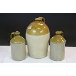 Three vintage Stoneware Jugs to include one marked for "Evens Bristol" and standing approx 37cm