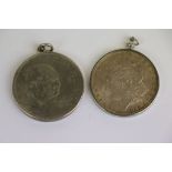 Two vintage pendant mounted Coins to include a Churchill Crown & an 1886 Morgan Silver Dollar,