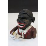 Painted Cast Iron Money box in the form of a Native African. stands approx 14cm