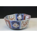 Japanese Octagonal Bowl decorated in Imari Colours with Panels of Flowers and Bats, 28.5cms diameter