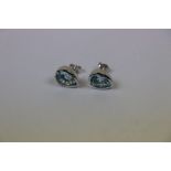 Pair of silver and blue topaz pear shaped earrings