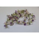 Gemstone necklace formed of polished tear drop shaped gemstones, comprising amethyst, citrine,