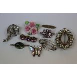 Selection of brooches to include silver