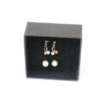 Two pairs of Gold Earrings one set with coral