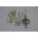 Silver cz and blue topaz pendant necklace on silver chain