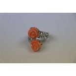 Silver and CZ Cross over Ring with flower shaped coral panels