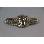 Art Nouveau style silver brooch modelled as a stylised female head with stars in her hair, makers