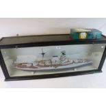 A Large Diorama Model Of HMS WARSPITE Within A Glazed Dislay Cabinet Together With Two Postcards