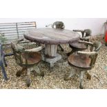 Large Wooden Iron Bound Circular Garden Table raised on a substantial tree trunk pedestal with