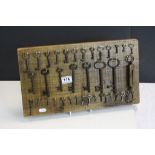 Oak Key board with a Collection of vintage Keys to include a Salter's Pocket Balance Scales