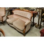 Victorian Style Two Seater Upholstered Sofa with Scrolling Arms and raised on bulbous feet,