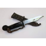 A Russian AK47 bayonet with 14.5cm serrated blade and wire cutting scabbard.