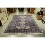 Large Eastern blue ground rug, 323cms x 204cms