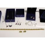 Three boxed Swarovski jewellery sets plus a stone set pair of yellow metal earrings and a necklace