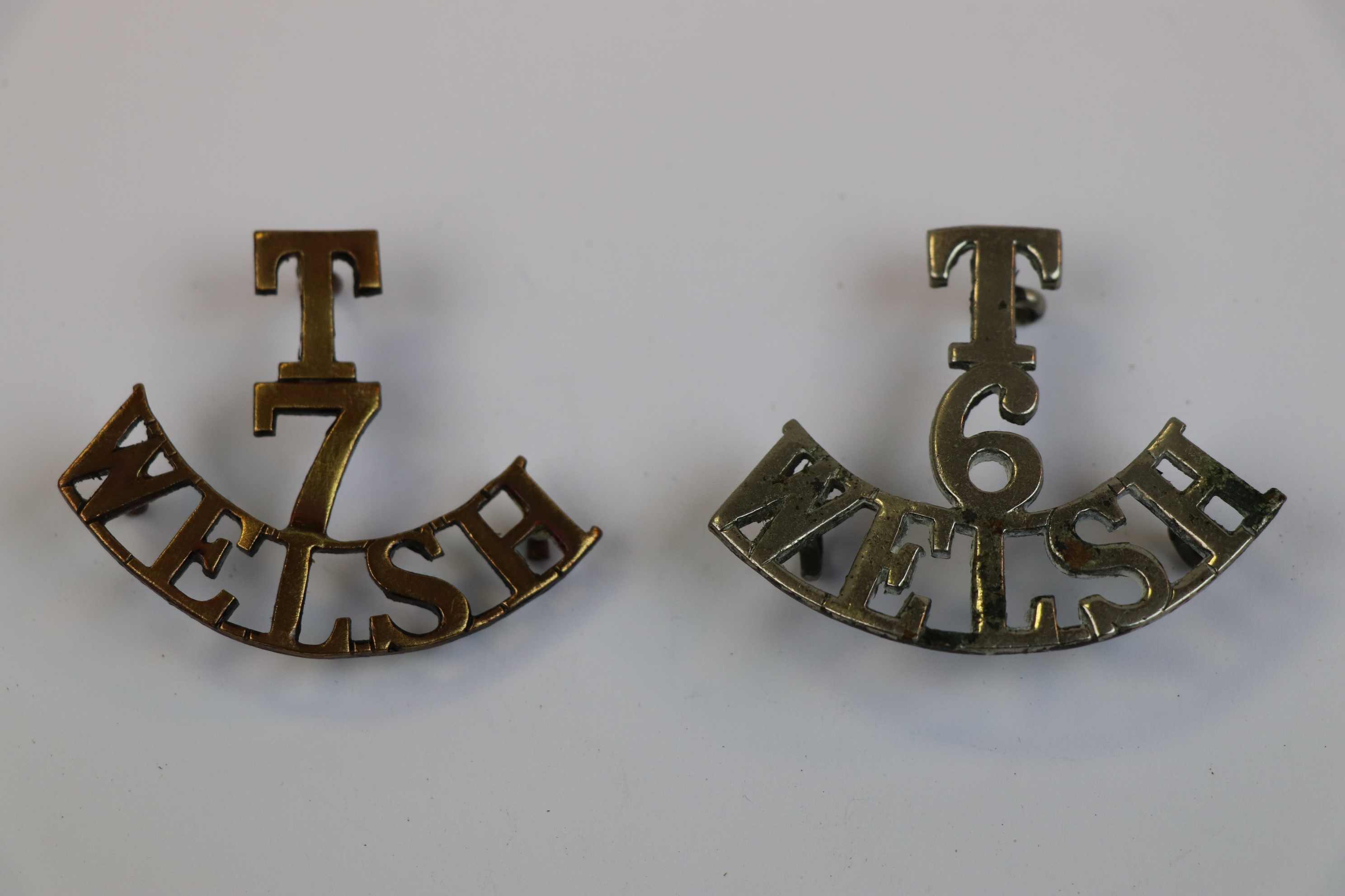 Two Shoulder Title Badges To The 6th And 7th Welsh Territorial Regiment.