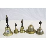 Four vintage Bronze hand Bells with ebonised Wooden handles plus a similar Counter top example