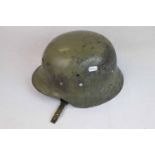 A Spanish Made, Spanish Army M42 Pattern Helmet With Helmet Liner And Chin Strap.