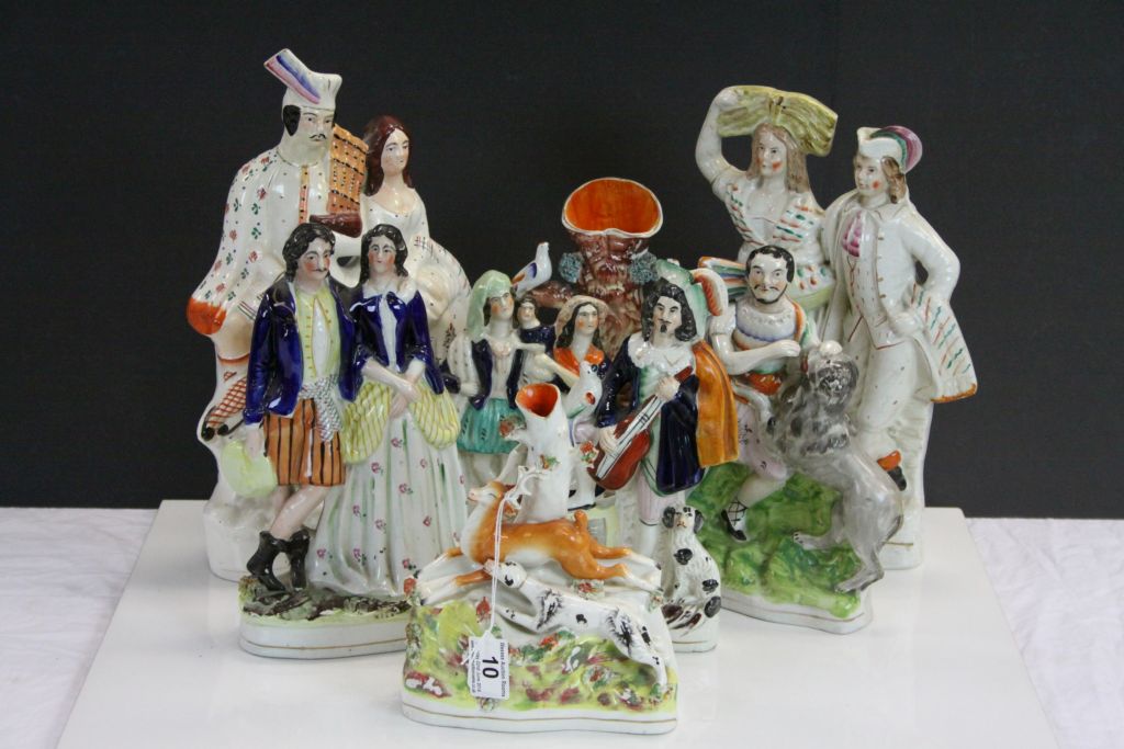 Eight large 19th Century Staffordshire flatbacks to include Spill Vases & figural groups, tallest