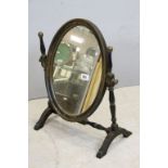 19th century Black Lacquered and Gilt Decorated Oval Swing Mirror