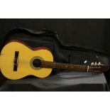 Acoustic Guitar with label ' Model no KG265 ' in soft carry case
