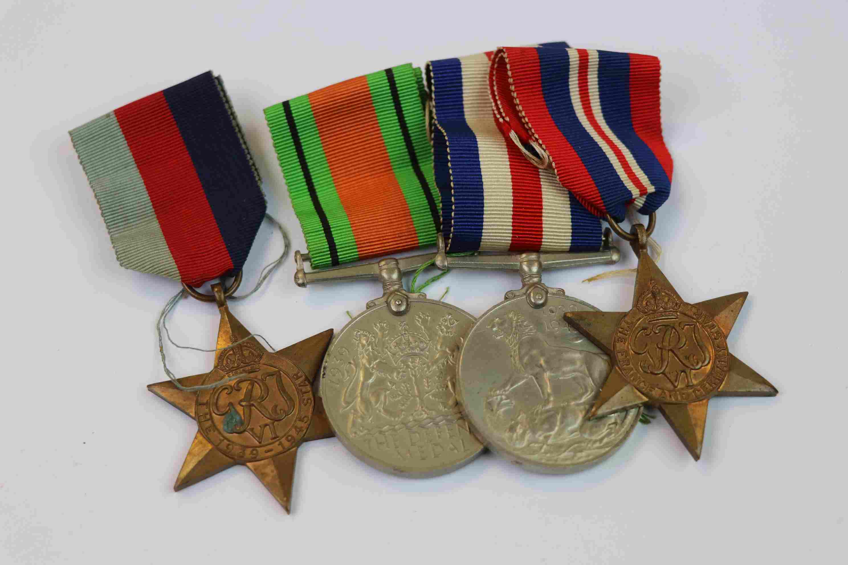 A Full Size World War Two / WW2 British Medal Group To Include The British War Medal, The Defence