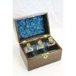 19th Century Oak three bottle Tantalus box with Brass fittings & key, containing three Gilt detailed