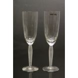 Boxed pair of Lalique Glass Champagne flutes approx 21.5cm tall and engraved to base "Lalique