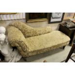 Late Victorian Chaise-lounge with scroll arm and shaped back raised on turned legs with castors