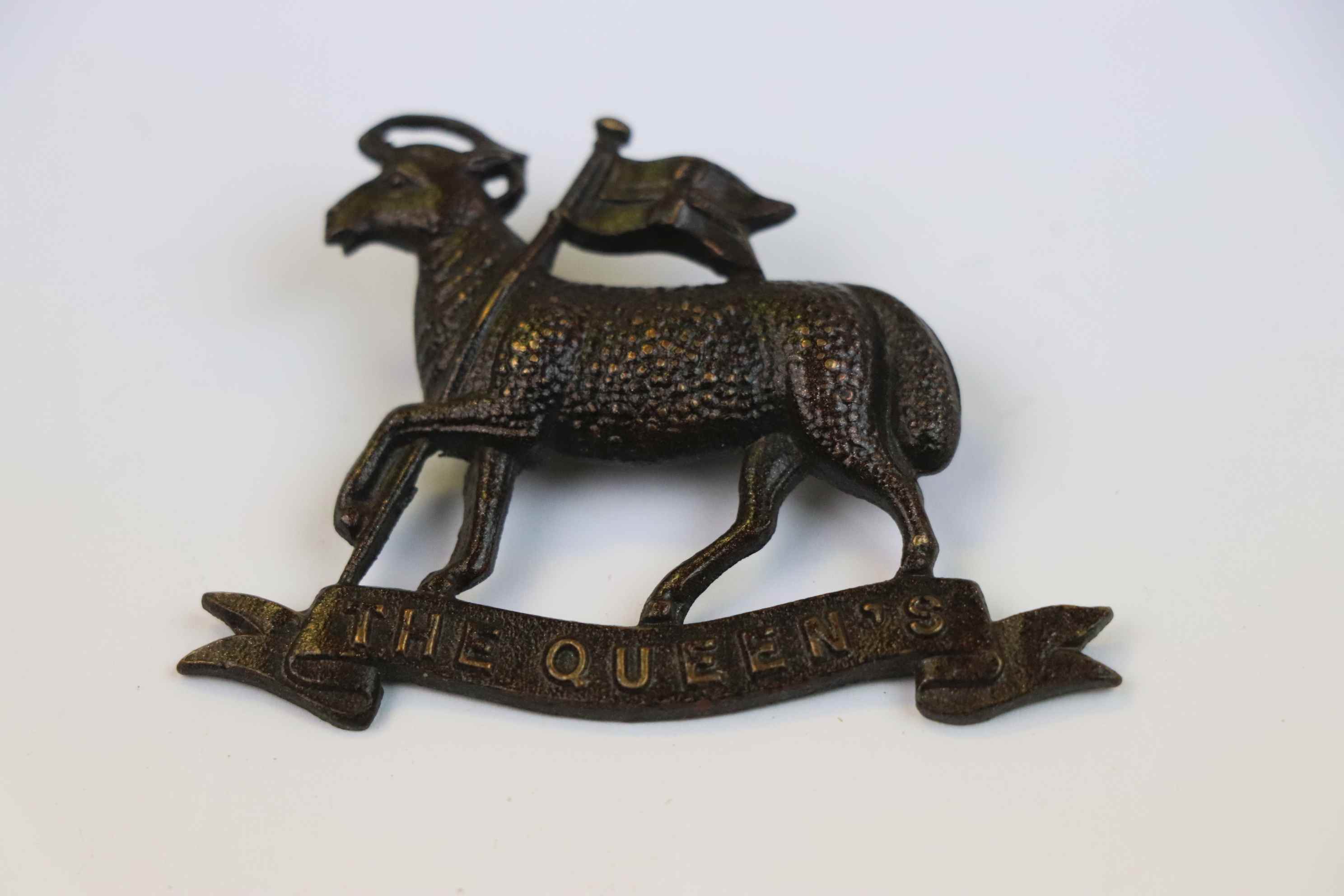 A World War One Queens Own Regiment Cap Badge.