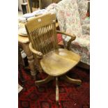 Late Victorian oak swivel office arm chair