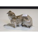 A Rosenthal recumbent porcelain whippet impressed Karner and no.80 to underside