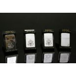 Four boxed vintage Zippo Lighters, three with American interest