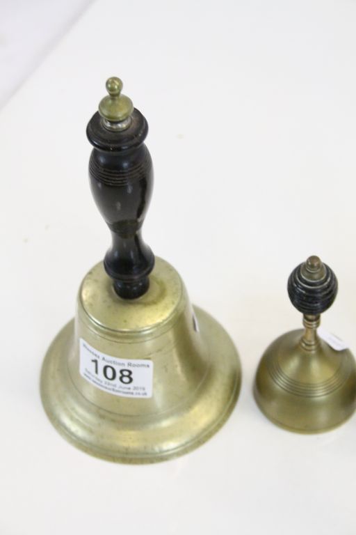Four vintage Bronze hand Bells with ebonised Wooden handles plus a similar Counter top example - Image 2 of 4