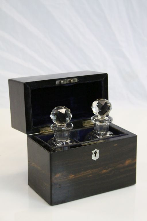 19th Century two Bottle Coromandel Tantalus with cut glass bottles, Mother of Pearl escutcheon and