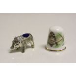 Silver pig pincushion with silver thimble