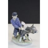 Royal Copenhagen ceramic Figural group of a Boy with Calf and numbered 772 to base, stands approx