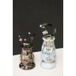 Two vintage Japanese ceramic Hatpin stands with a collection of vintage Hatpins to include Silver