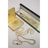 Boxed simulated three strand Peral necklace with 9ct Gold clasp, two single strand examples and a